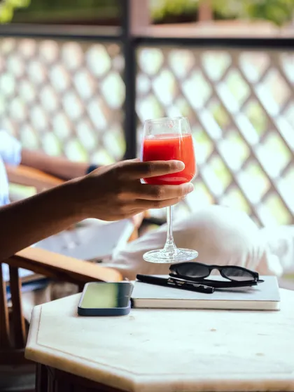 A refreshing drink, a notebook, and a peaceful view. Sometimes the simplest moments are the most luxurious. Find yours in our tranquil lounge spaces.