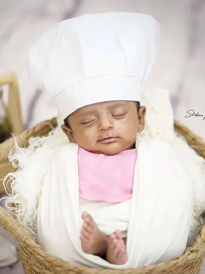 Even the tiniest babies can be a little chef in the making. This newborn is dreaming of future culinary creations in this adorable themed setup.