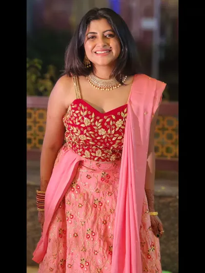 A playful and modern pink and red lehenga, perfect for a fun sangeet or reception party.