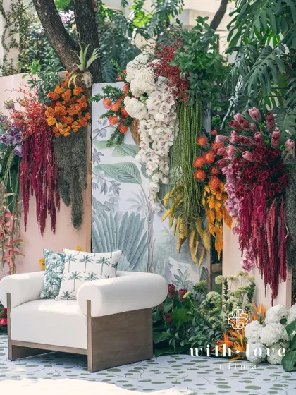 The full seating arrangement for the 'Garden of Gaia' ceremony, with the lush floral wall as the stunning focal point.