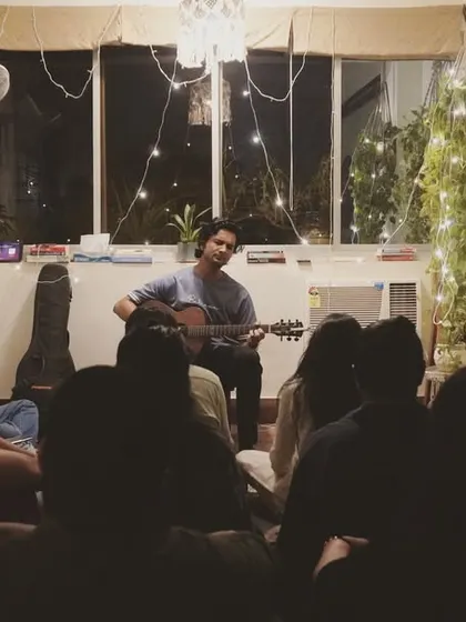 Performing my heart out for a beautiful audience at an intimate music gathering. There's something special about sharing songs and stories in such a close and personal setting.