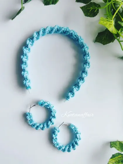 A full view of the matching light blue macrame hairband and earrings set. This is a great gift idea for friends, bridesmaids, or for yourself!