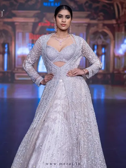 A powerful runway look in the light peach Indo-Western masterpiece, designed for the modern bride.