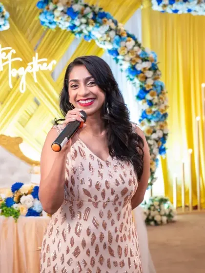 The host of a beautiful golden wedding anniversary party, setting the stage for a memorable celebration. Event photography is about capturing all the key players.