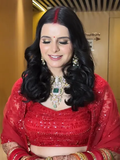 A close-up of Monika's reception makeup. The soft shimmer on the eyes and the perfectly blended skin create a look that is both glamorous and sophisticated.