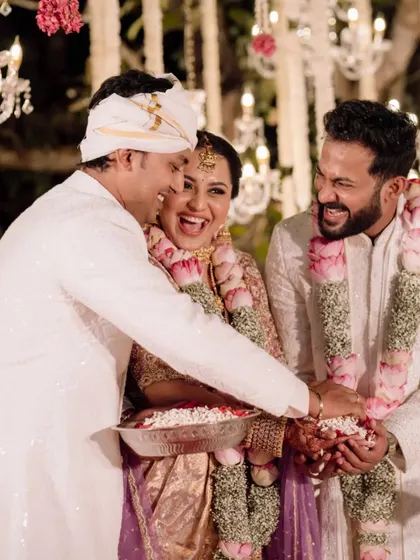 A fun moment during the wedding ceremony, with a family member playfully interacting with the couple.