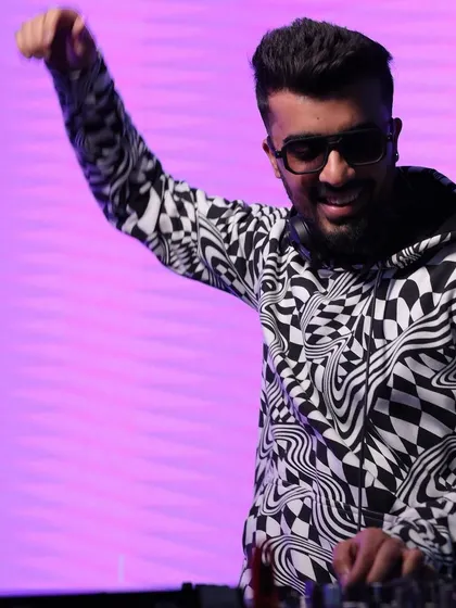 A duplicate of the happy DJ shot, because that positive energy is worth emphasizing. This is the face of a #partywithmonk.