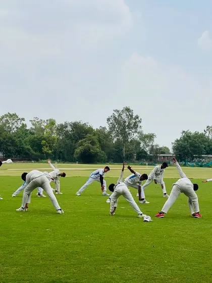 A synchronized stretching drill. This shows the unity and discipline of our team even during warm-ups.