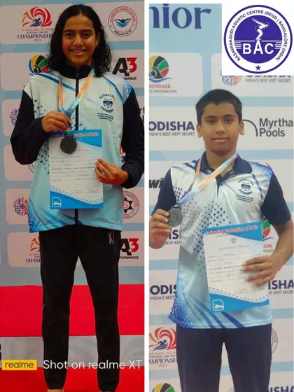 Adithi and Akshaj with their bronze medals in the 1500m Freestyle.