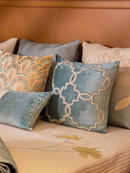 Perfect for adding a light and airy touch to your summer decor. This collection of cushions features soft teals, oranges, and creams with geometric and botanical patterns, creating a fresh aesthetic.