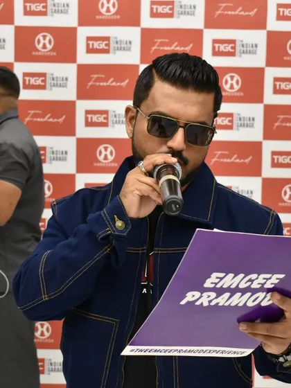 A candid shot while hosting the launch of The Indian Garage Co. store. Managing the media and the crowd at a high-profile launch requires focus and energy.