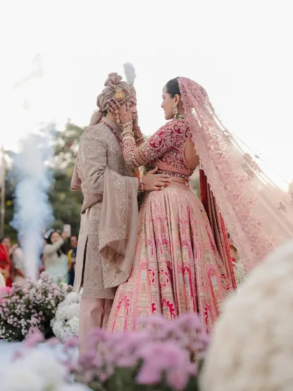 A tender touch during the ceremony. These small gestures of love and support are the details that make a wedding story complete.