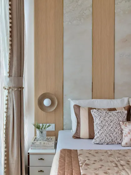 This earth-toned bedroom is a beige dreamscape designed to soothe the soul. By layering different shades of brown and beige with varied textures, I created a contemporary space that feels like a warm, cozy retreat.