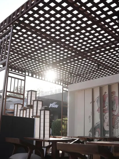 The Ebisu pop-up restaurant during the day, with sunlight filtering through the latticed wooden roof. This design element created beautiful shadow patterns and provided a semi-open-air feeling.