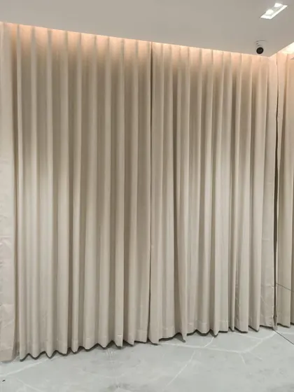 The same elegant curtains, shown closed to demonstrate their full, luxurious drape and light-blocking capability.