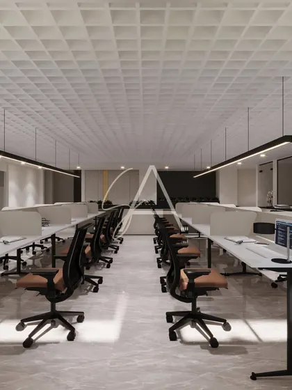 Another perspective of the open-plan office, emphasizing the symmetry and order of the layout. The consistent use of ergonomic chairs and clean white desks promotes a sense of unity and focus.