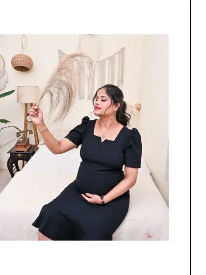 A playful and serene moment in our Boho studio. The mom-to-be is holding a piece of pampas grass, connecting with the natural elements of the set. Her simple black dress keeps the focus on her and her joyful expression.