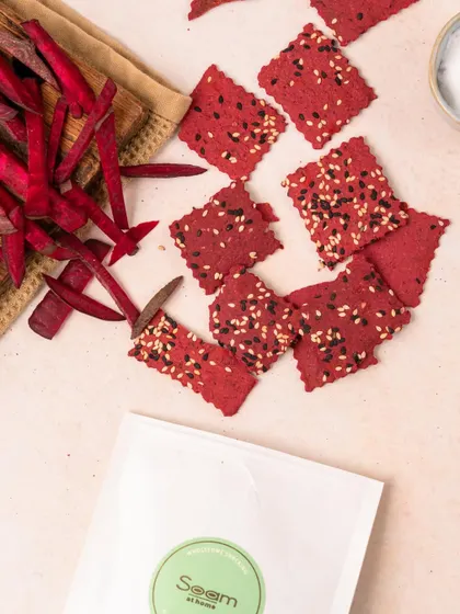 My vibrant Beetroot Crackers, made with the natural goodness of beetroot and sprinkled with sesame seeds. They are crunchy, tasty, and a great way to snack colourfully.