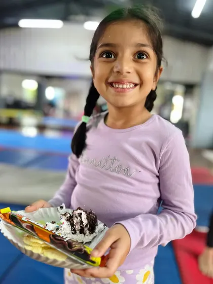 A huge smile for a plate of cake. The simple joys are often the best, and we love to celebrate them.