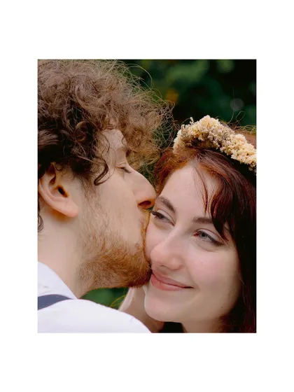 A gentle kiss, a quiet moment of affection. This close-up from the Swiss elopement captures the deep intimacy and tenderness between the couple.