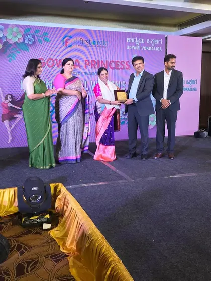 Receiving the award on stage at the Gowda Princess event. It was an honor to be recognized among so many inspiring women.