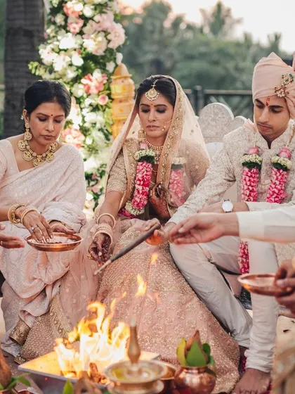 And suddenly you know, it's time to start something new. A sacred moment as the couple and their parents participate in the havan (holy fire) ceremony, surrounded by blessings.