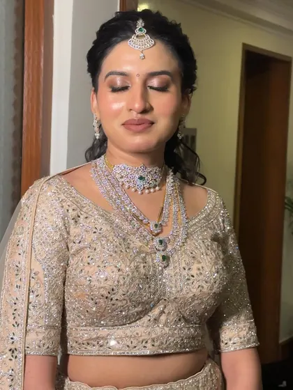 A close-up of Damini's minimal and gorgeous reception makeup. The soft, shimmering eyeshadow and flawless skin create a look that is sophisticated and chic.