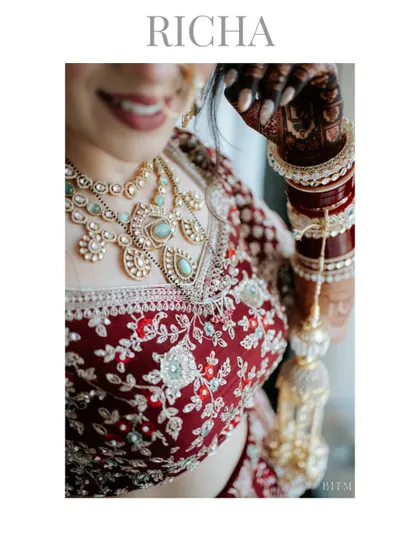 A detailed shot focusing on the bride's stunning jewelry and the intricate embroidery of her lehenga. These details are an essential part of her story.
