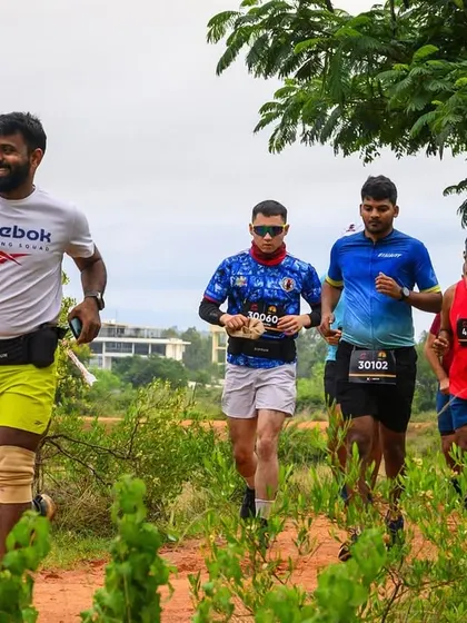 Running with the pack during a trail race. The shared experience of navigating the terrain together is a core part of ultra running.