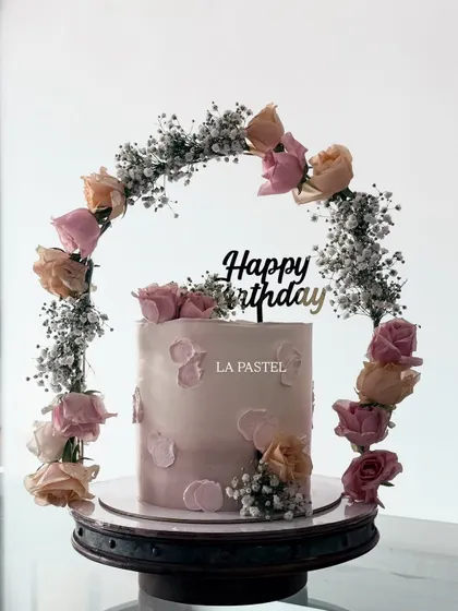 A closer look at the beautiful floral tiara cake. The combination of peach and pink roses with delicate baby's breath creates such a soft and romantic feel.