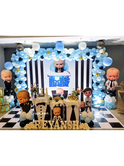 I can execute any theme you can imagine, like this fun Boss Baby birthday party. The setup features a checkerboard floor, character cutouts, and a black, white, and blue balloon arch for a sharp and playful look.