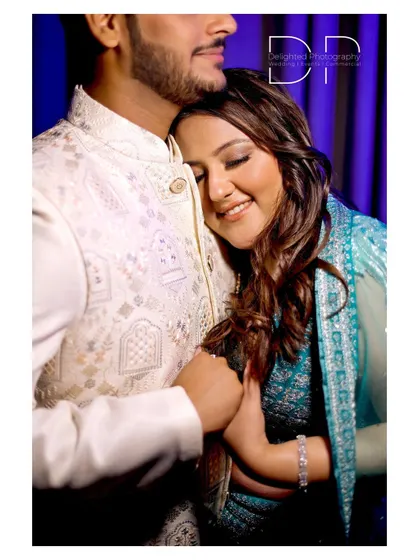 An intimate and heartfelt embrace, capturing the bride-to-be resting her head on her partner's chest, a perfect picture of comfort and love.