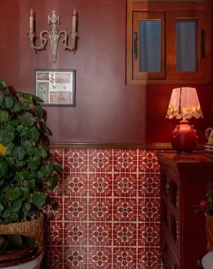 We went bold in this Dhaka bathroom with rich red walls and vibrant patterned tiles. Paired with vintage-style fixtures and lush greenery, the space feels dramatic, personal, and full of character.