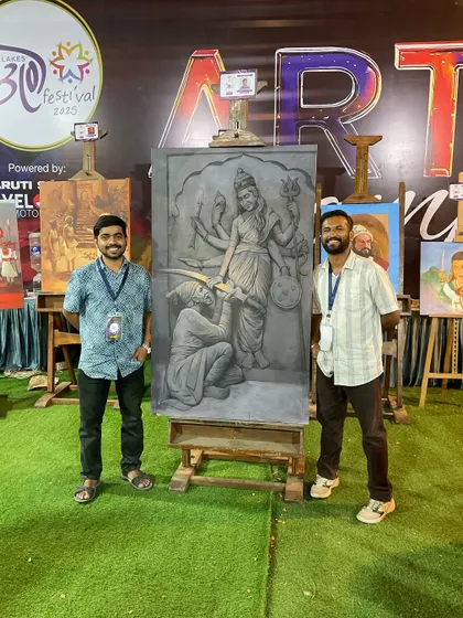 Posing with a fellow artist and my completed painting at the Thane Art Festival. These events are a great way to connect with the community and share the artistic process.