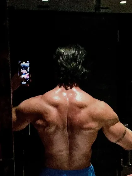 You'll never find an athlete I coach with a weak back. We build strength and thickness from top to bottom. This is a back selfie showing that principle in action.