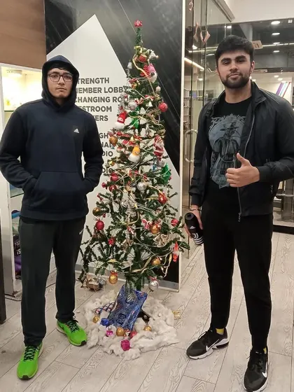 Two members enjoying the festive atmosphere during our Christmas celebration at the club.