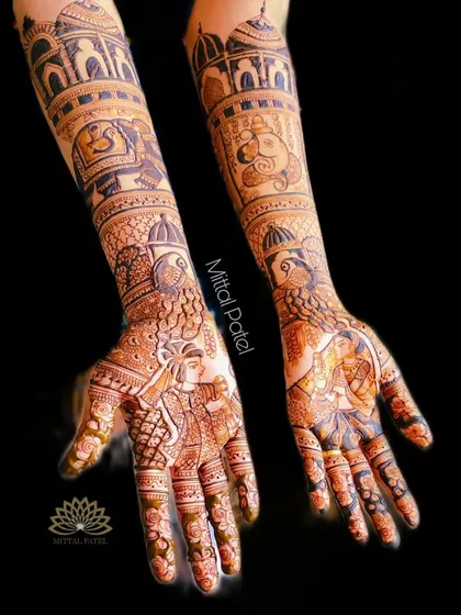 Another view of the heavy bridal mehndi against a black background, highlighting the beautiful contrast and the complexity of the design.