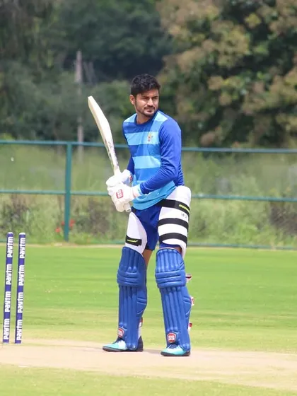 Professional cricketer Manish Pandey at the crease on our ground. Our facility is the ultimate training hub for champions.