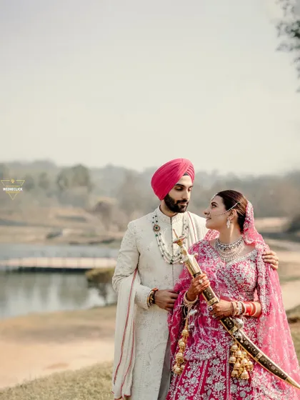 We believe in capturing the couple within the beauty of their chosen location. This portrait from a Sikh wedding by the lake shows how we blend stunning landscapes with the couple's serene presence to create a truly memorable destination wedding photograph.