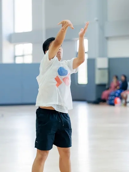 A young player practicing his shooting form. Building good habits early is key.