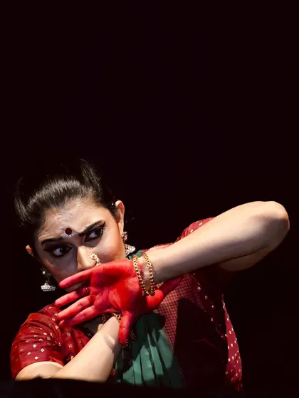 A dramatic close-up from the Kanhopatra performance in Aurangabad. The red alta on the hands is a significant part of the storytelling.
