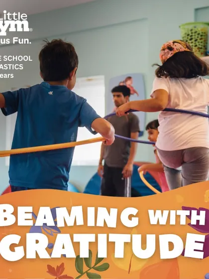 Teamwork and fun go hand in hand. Using hula hoops and sticks, these grade schoolers engage in a group activity that improves coordination and social skills, all while 'Beaming with Gratitude' for their teammates.
