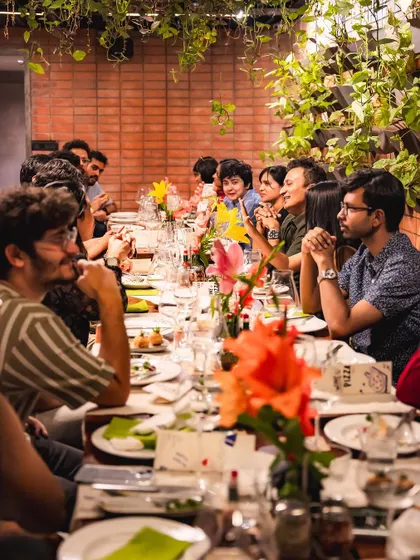 Another view of our packed community table, with guests listening intently during the wine tasting.