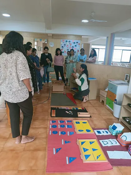 Parents get a close look at the sensorial materials their children work with every day.