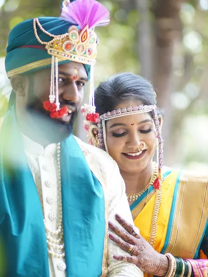 A beautiful candid of the couple, lost in their own world. The bride's makeup is soft and romantic, perfect for capturing these unscripted moments of love.