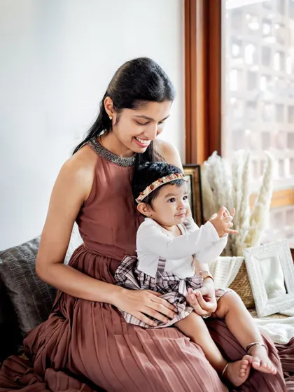 A beautiful mother and daughter portrait by the window. The natural light and black and white processing create a soft, timeless image.