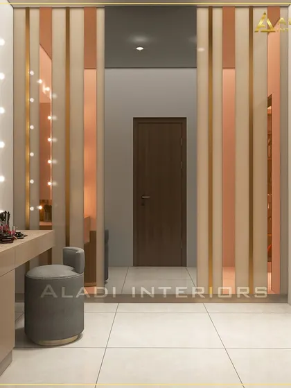 A view of the dressing area, showing the vanity table and the elegant rose-gold and mirrored paneling of the adjacent wardrobe, creating a glamorous and cohesive space.