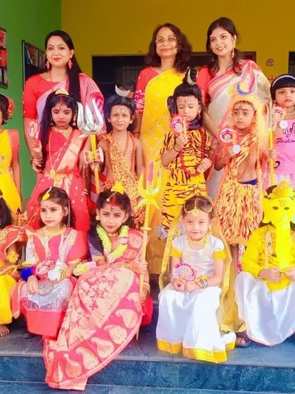 A group photo of the young performers with their teachers. I work closely with schools to ensure every child has a costume that fits well and looks great on stage.