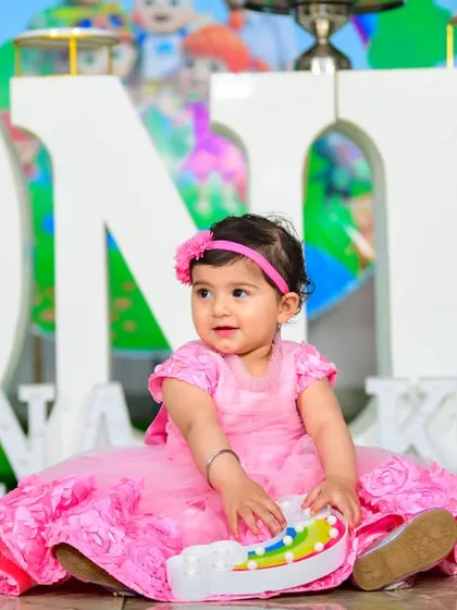 A magical 'Frozen 2' themed birthday party, transforming the venue into an enchanted forest with earthy tones, character cutouts, and shimmering backdrops.