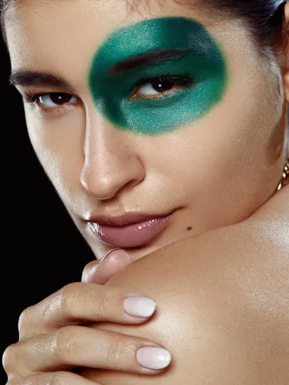 A student's second portfolio shoot gets a whole lot greener and glam with this bold, circular green eyeshadow look.